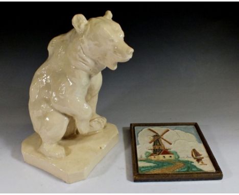 A pottery polar bear, 19cm and a Delft tile 