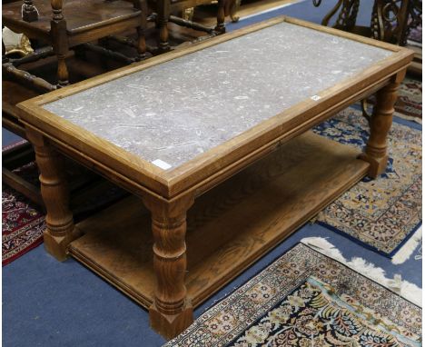 An oak and fossil marble coffee table W.135cm