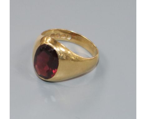 An 18ct gold and red paste set signet ring, size J/K