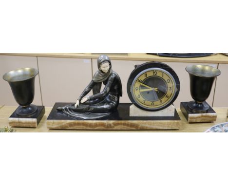A Deco bronzed metal figural clock garniture