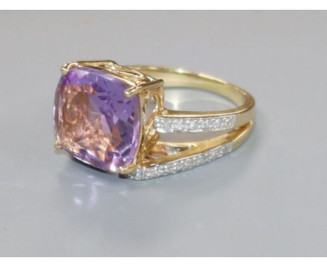 A modern 14ct gold, amethyst and diamond dress ring, size O.