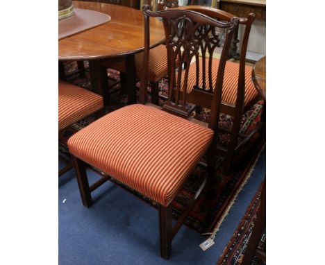 A set of twenty four Chippendale style dining chairs