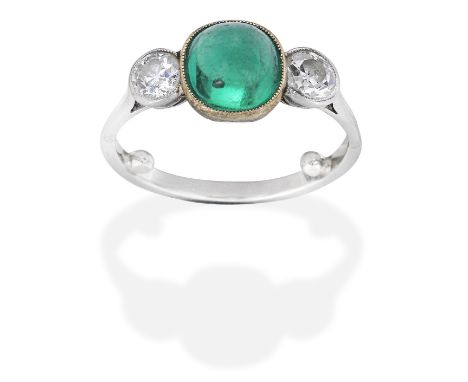 EMERALD AND DIAMOND THREE-STONE RING, EARLY 20TH CENTURYSugarloaf cabochon emerald and old brilliant-cut diamonds, diamonds a