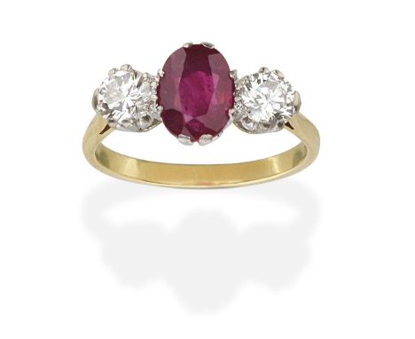 RUBY AND DIAMOND THREE-STONE RING, 1987Oval-cut ruby and brilliant-cut diamonds, mounted in 18 carat gold, ruby approx. 1.00c