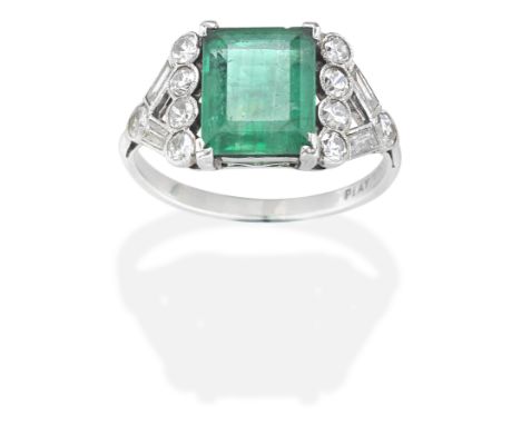 EMERALD AND DIAMOND RINGThe step-cut emerald between brilliant and baguette-cut diamond openwork shoulders,  emerald approx. 