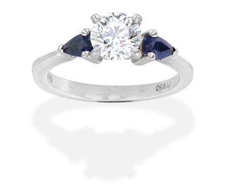 DIAMOND AND SAPPHIRE RINGBrilliant-cut diamond, pear-shaped sapphires, diamond approx. 0.80ct, ring size approx. KFor further