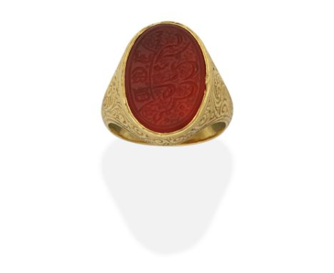 CARNELIAN INTAGLIO RING, 18TH - 19TH CENTURYOval, the Mughal script with three initials in gothic capital letters, in an elab
