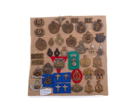 THE REGIMENTS OF THE GUARDS DIVISION,a display of cloth and cap badges for the Grenadier, Coldstream, Scots, Irish and Welsh 