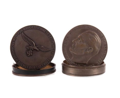 TWO REICHSMARSCHALL GÖRING BOXES,white metal and resin, each embossed with portrait bust and inscriptions, 7.5cm diameter