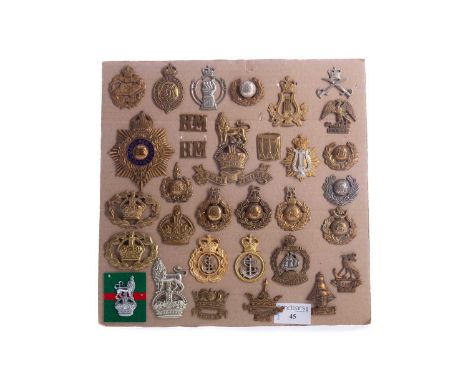 ROYAL MARINES OFFICER'S HELMET PLATE,enamelled with twin lug fitting, along with a Royal Marines pouch badge, Royal Navy badg