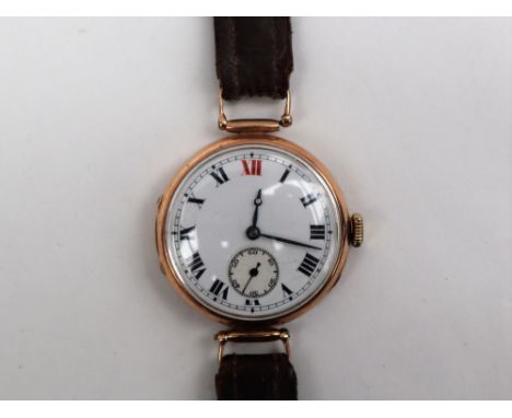 A Gentleman's 9ct gold wristwatch, the white enamel dial with Roman numerals and a seconds subsidiary dial, the movement mark