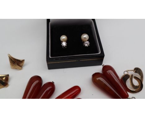 A pair of pearl and paste set earrings, to a white metal post together with hardstone pendant drop earrings, yellow metal ear