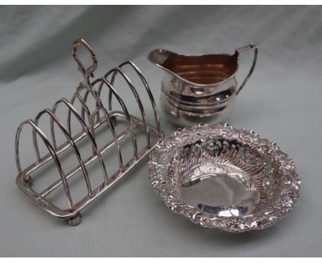 A late Victorian silver bon bon dish, with a scrolling flora; embossed border and pierced sides, Sheffield 1900 together with