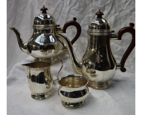 An Elizabeth II silver four piece teaset, comprising a hot water pot, teapot, cream jug and sugar basin, all of baluster shap