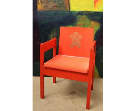 The Earl of Snowden and Carl Toms, a red painted beech and laminate elbow chair produced for the Investiture of the Prince of