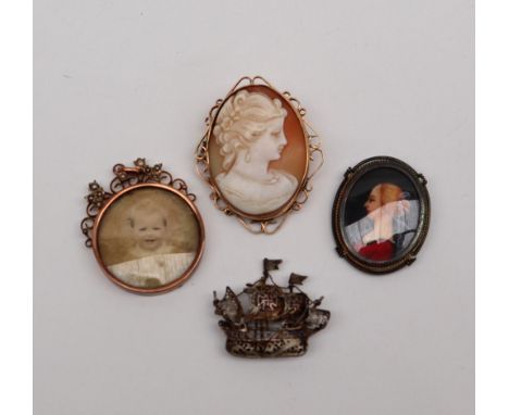A shell cameo brooch, depicting a lady in profile in a 9ct yellow gold mount together with a painted portrait brooch, a white