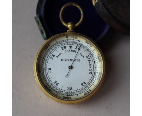 A yellow metal compensated pocket barometer, with a silvered dial, 50mm diameter