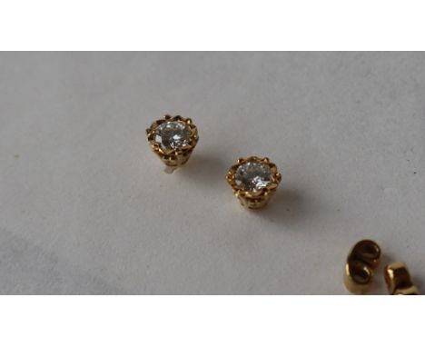 A pair of diamond stud earrings, the round brilliant cut diamonds each approximately 0.5ct to an 18ct yellow gold setting and