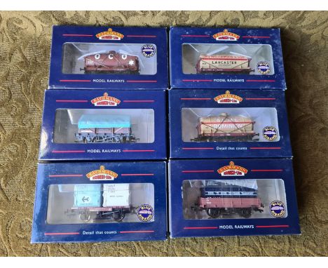 6 x Bachmann Branch Line company logo tankers and plank wagons.