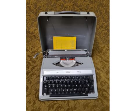 Vintage W H Smith grey Fox portable typewriter.