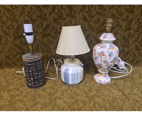 Poole pottery and Royal Winton chintz table lamps together with a further Studio pottery lamp.