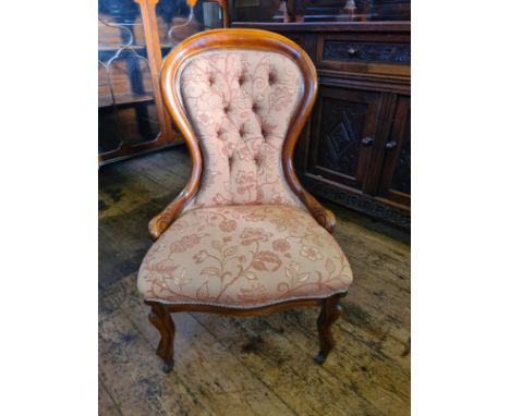 Victorian mahogany button back chair upon cabriole legs, recently upholstered in peach William Morris type fabric.