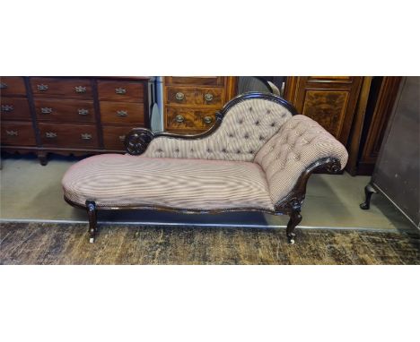 Victorian button back chaise longue with scrolled and swept back, pierced scroll carvings and serpentine front rail.