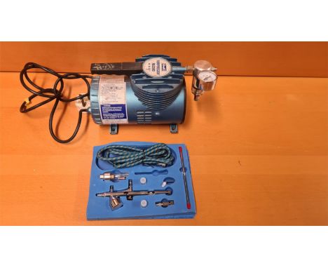 Revell Kompresser Record Art No. 3671 airbrush compressor together with model airbrush kit.