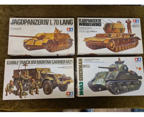 4 x Tamiya 1/35 scale WWII military model vehicles.  Flakpanzer IV Wirbelwind, M4A3 Sherman, Jagdpanzer IV L/70 Lang and M21 