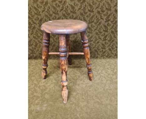 Early 20th century button top stool.