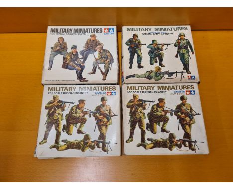 4 x Tamiya military miniatures 1/35 scale. German Army Infantry, German soldiers seated, 2 x Russian Infantry.