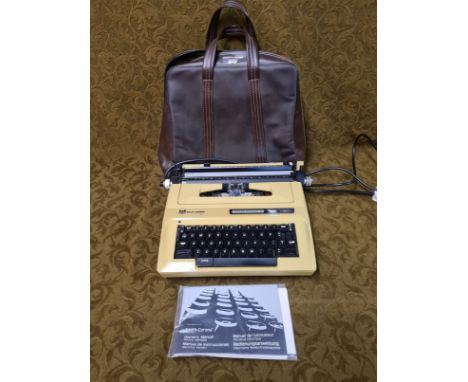 Vintage Smith Corona Sterling automatic portable electric typewriter with original carry bag, instructions, in working condit