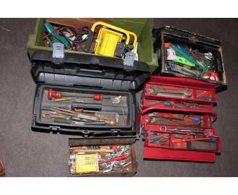Five tool boxes with tools.
