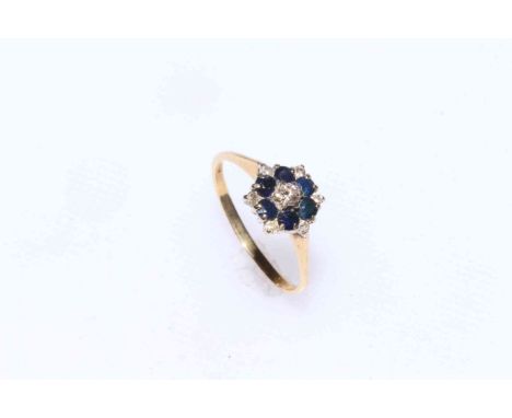 18 carat gold sapphire and diamond cluster ring.