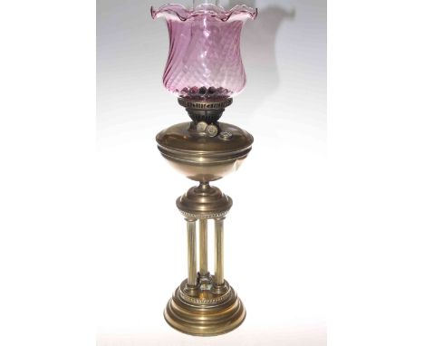 Brass three reeded column oil lamp with ruby glass reservoir.
