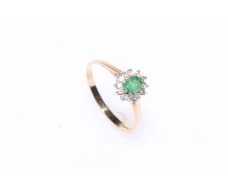 9 carat gold, emerald and diamond cluster ring.