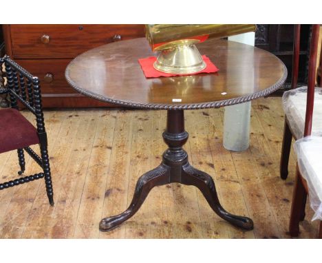 19th Century circular mahogany snap top supper table on pedestal tripod base, 72cm by 93cm diameter.