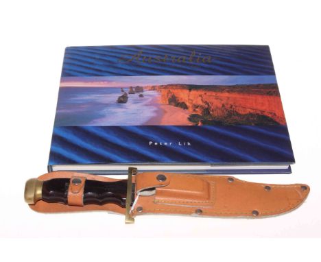 Vintage crocodile hunters bowie knife and Australia book.