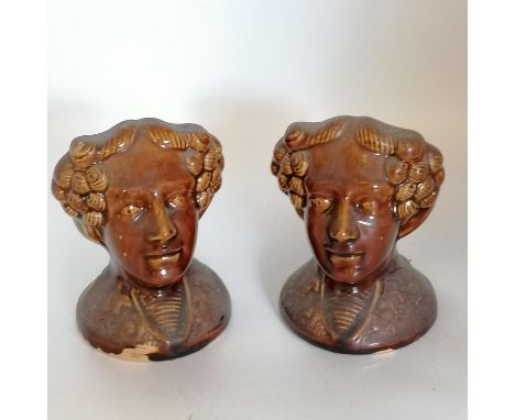 Pair of 19th century window sash rest stops  modelled in the shape of ladies heads.The 'treacle' glazed pottery stops are a r