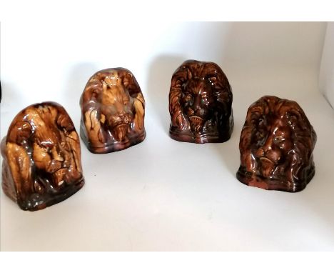 2 pairs (1 pair lighter than the other) 19th century window sash rest stops modelled in the shape of lion heads.The 'treacle'
