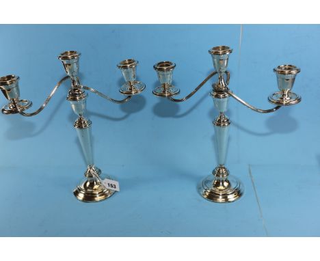 A PAIR OF 20TH CENTURY STERLING SILVER THREE-LIGHT TWIN BRANCH CANDELABRA raised on circular bases, stamped "ALVIN" STERLING,