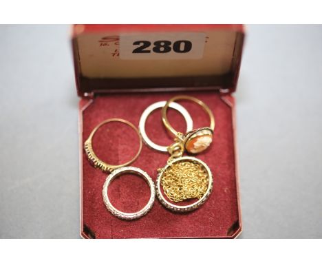 A 9CT GOLD SHELL CAMEO RING, a Ruby set RING, three various ETERNITY RINGS and a yellow metal NECKCHAIN.   