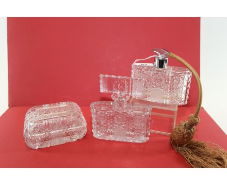 AN ART DECO OBLONG CUT CRYSTAL ATOMISER, 4 1/4 ins high, matching SCENT BOTTLE AND STOPPER and a matching BOX AND COVER. (3)