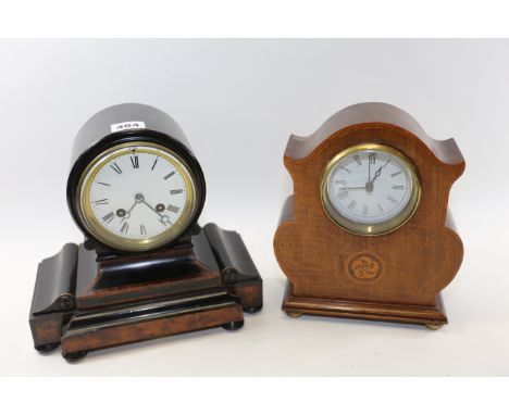 A LATE VICTORIAN EBONISED AND WALNUT DRUMHEAD MANTLE CLOCK, white enamel dial with French twin train movement, 9 ins high and