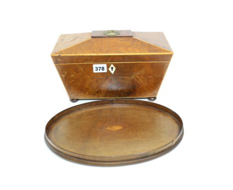 AN EARLY 19TH CENTURY MAHGANY SARCOPHAGUS SHAPED TEA CADDY, boxwood string, the interior with two lidded compartments and cen