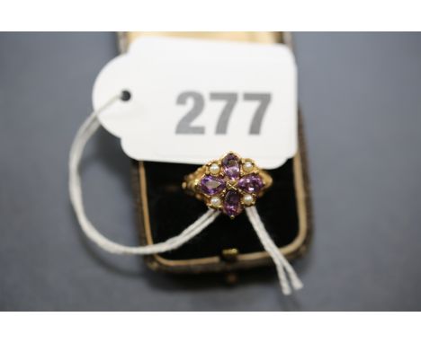A VICTORIAN STYLE AMETHYST AND PEARL RING, with carved shoulder's, size 0.   