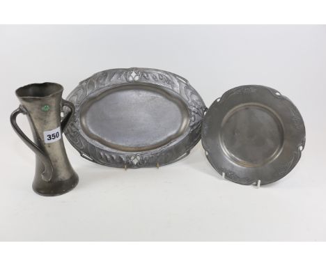 AN EARLY 20TH CENTURY TUDRIC PEWTER DOUBLE HANDLED VASE set with two cabochons (one missing), stamped 030 TUDRIC, 7 ins high,