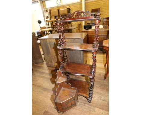 A LATE VICTORIAN SERPENTINE FRONTED FOUR TIER WHATNOT with turned uprights and feet, 20 ins wide and an Art Nouveau oak HANGI