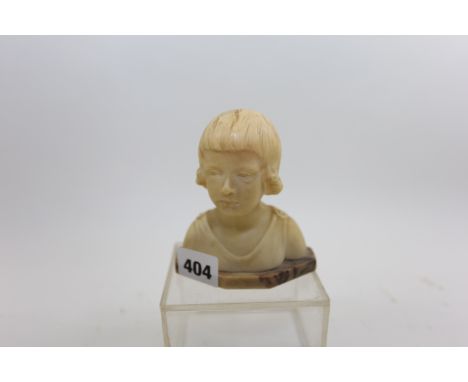 SCHRINGCHER, AN ART NOUVEAU PERIOD ALABASTER BUST OF A YOUNG GIRL, the variegated canted base inset with signature plaque, 4 