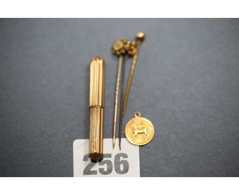 AN 18CT GOLD "SAGITTARIUS" PENDANT, a 15ct gold diamond headed STICK PIN, two OTHERS and a 9ct gold PROPELLING PENCIL.   